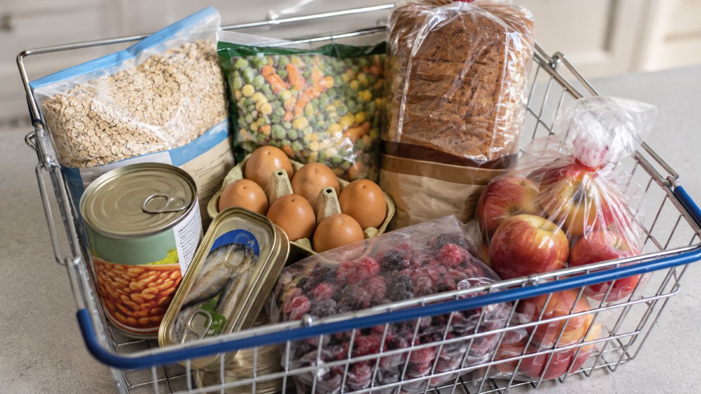 A UK supermarket basket of oats, tinned beans, sardines, eggs, frozen vegetables and berries for the best diet to lose belly fat