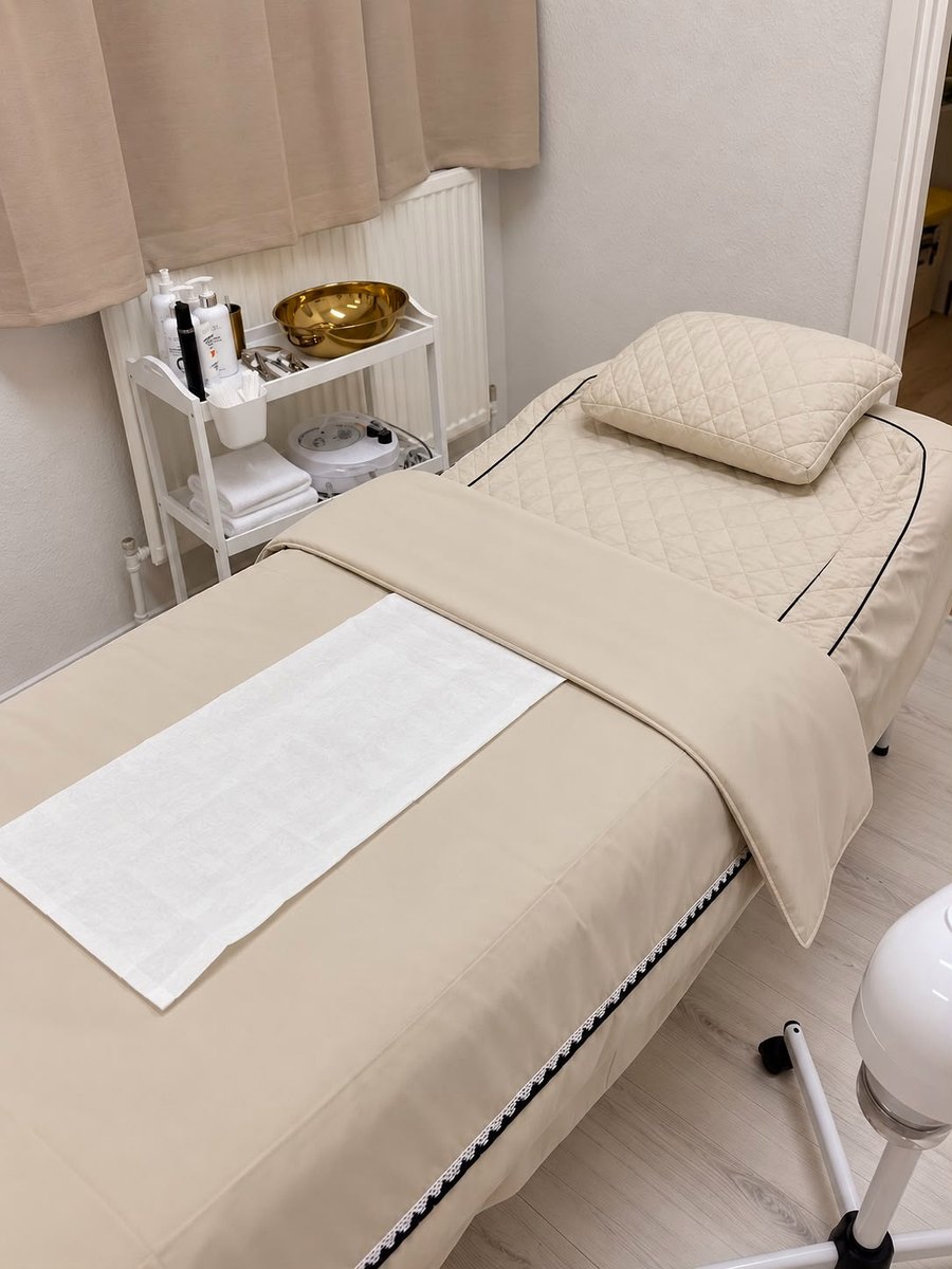 Treatment room at J Artistry Clinic in Coventry, prepared for a client