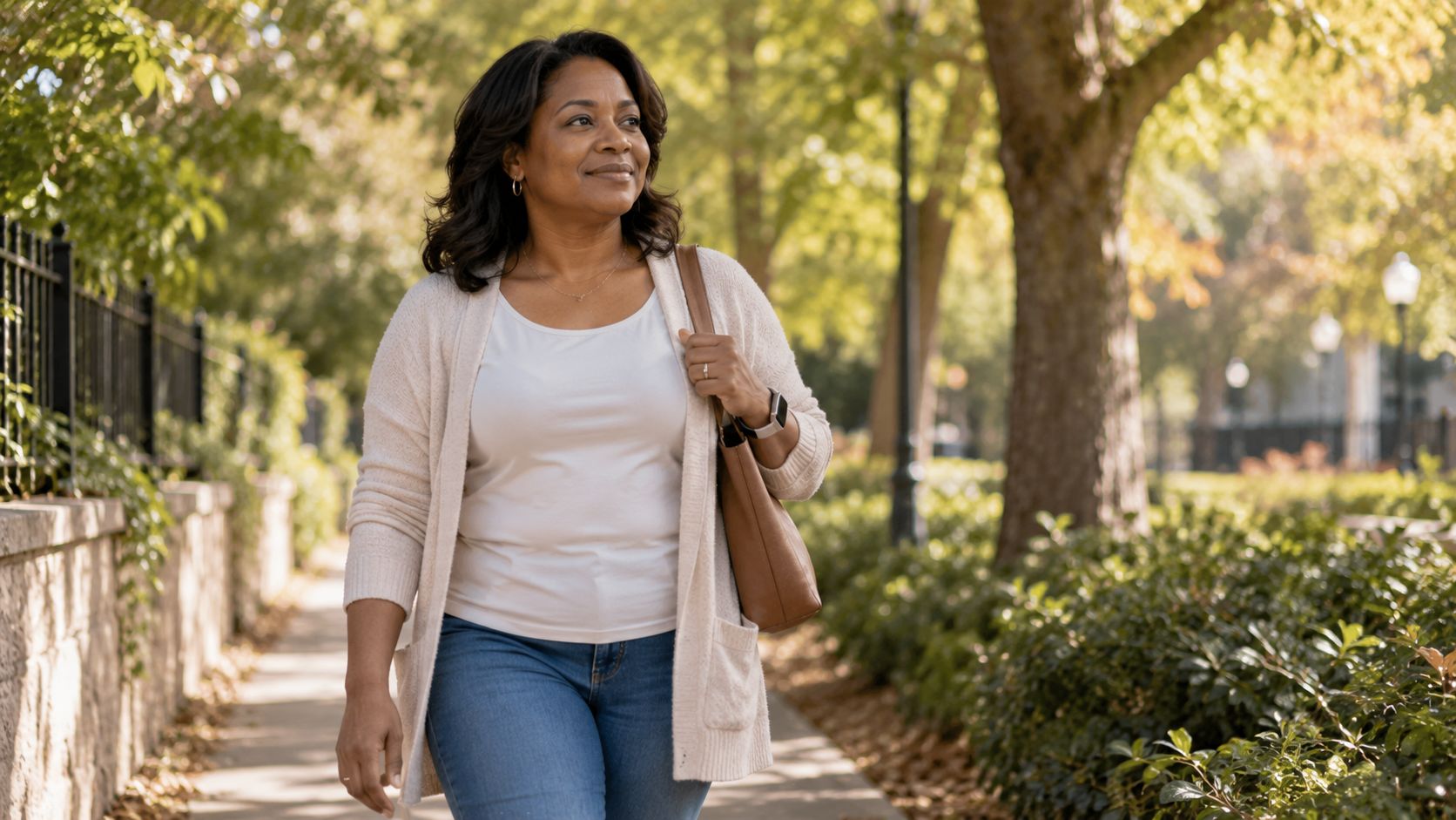 Woman walking outdoors in soft daylight, illustrating the everyday habits that reduce stress-related abdominal fat