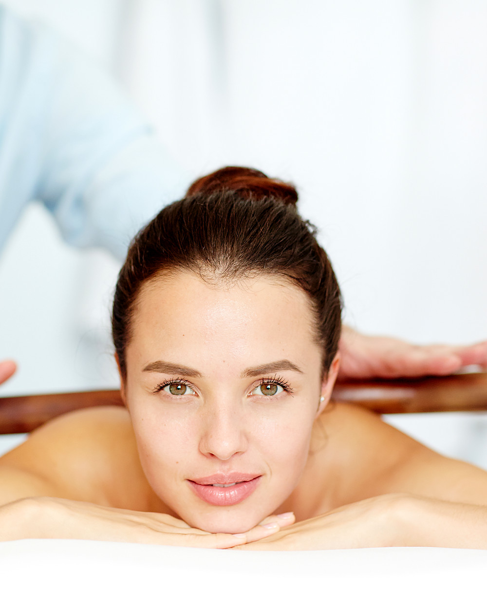 Client having a wood therapy massage with wooden tools at J Artistry Clinic in Coventry